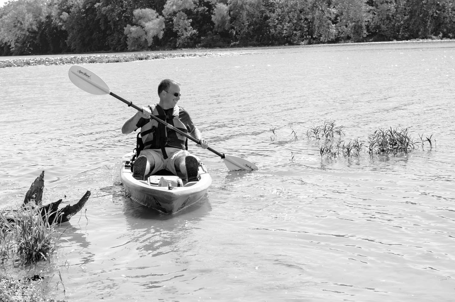 DAY AT THE LAKE: John Jungmann heads out to meet a group of Outdoor U students kayaking on Lake Springfield. He visits with students on a weekly basis during the school year.